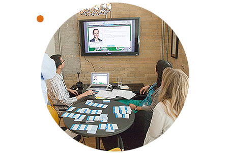 A team of professionals collaborate in ExperienceChangeⓇ's change management simulation.